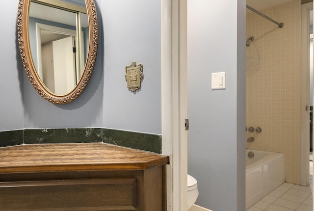 full bath with tile patterned floors, vanity, toilet, and shower / bathing tub combination