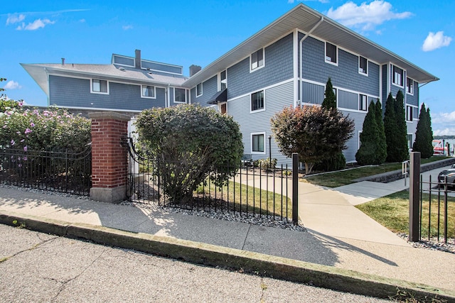 view of side of home with a fenced front yard