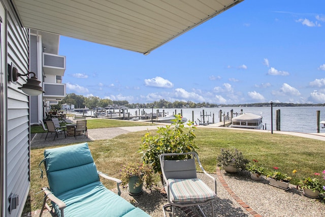 exterior space with a dock and a water view