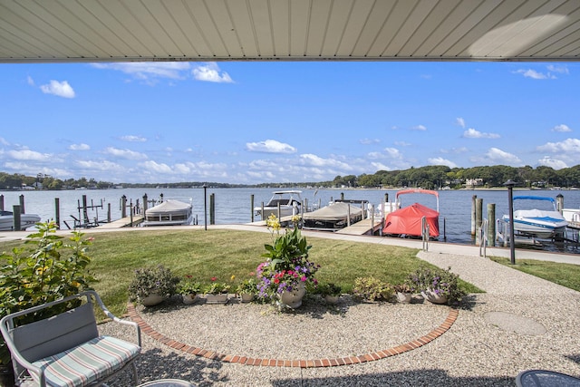 view of dock featuring a yard and a water view