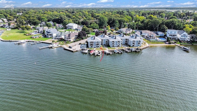 bird's eye view with a wooded view, a water view, and a residential view