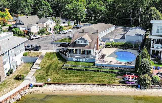 bird's eye view with a residential view and a water view