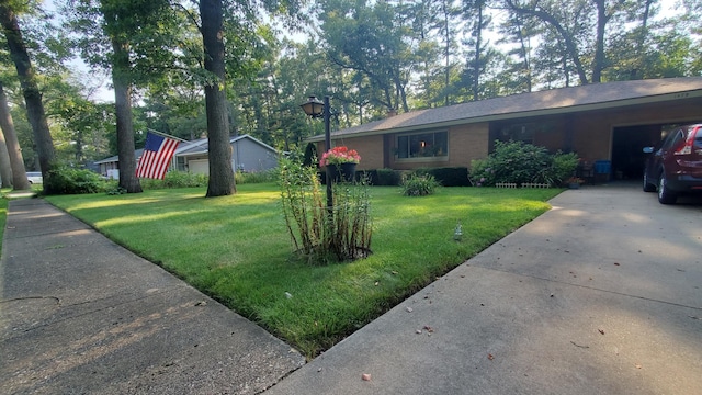 view of home's exterior with a garage and a yard