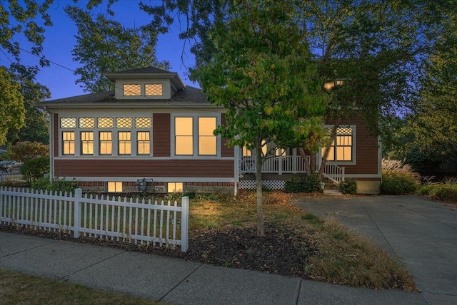 202 Oak St, South Haven, MI 49090 - view of front facade featuring a porch and fence