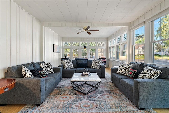 202 Oak St, South Haven, MI 49090 - living area with a healthy amount of sunlight, wood finished floors, and a ceiling fan