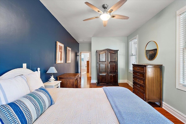 202 Oak St, South Haven, MI 49090 - bedroom with multiple windows, baseboards, and wood finished floors