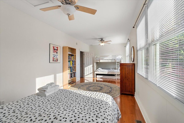 202 Oak St, South Haven, MI 49090 - bedroom featuring a ceiling fan, baseboards, and wood finished floors