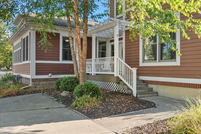 exterior space featuring a pergola and crawl space