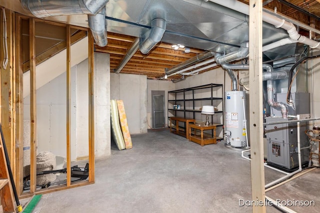 basement with heating unit and water heater