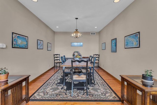 dining area featuring light wood-style floors, a notable chandelier, visible vents, and recessed lighting