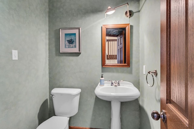 half bathroom with toilet