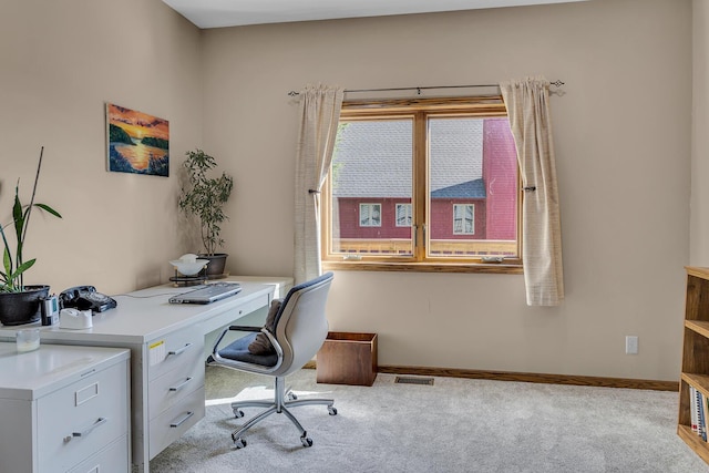 office space featuring carpet, visible vents, and baseboards