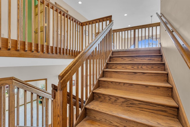 stairway featuring recessed lighting