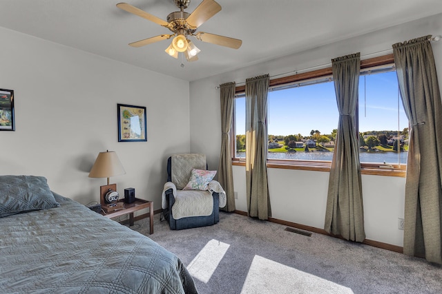 carpeted bedroom with ceiling fan