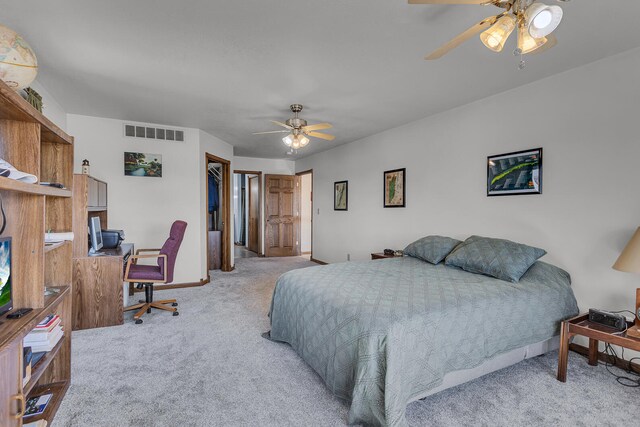 bedroom with light carpet and ceiling fan