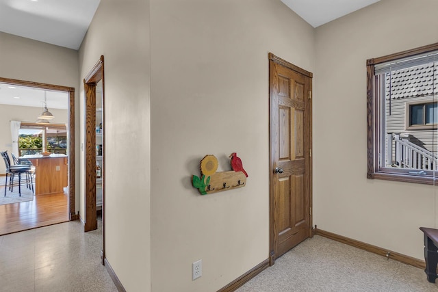 corridor with baseboards