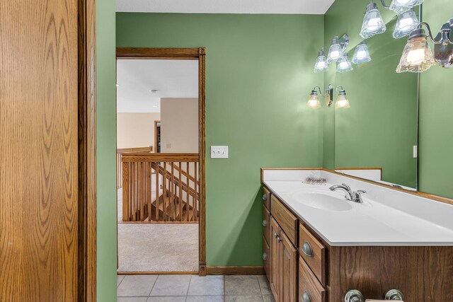 bathroom featuring tile patterned flooring and vanity