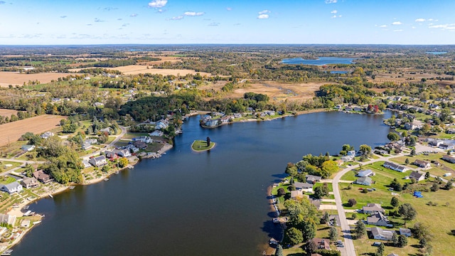 drone / aerial view with a residential view and a water view