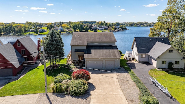 birds eye view of property with a water view