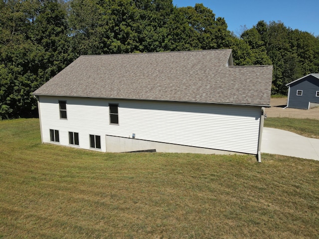 garage featuring a lawn