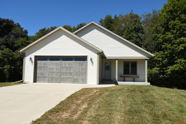 ranch-style home with a garage and a front lawn