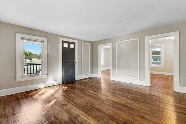 entrance foyer featuring dark hardwood / wood-style floors