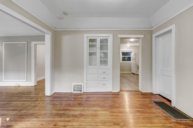 spare room featuring light hardwood / wood-style flooring