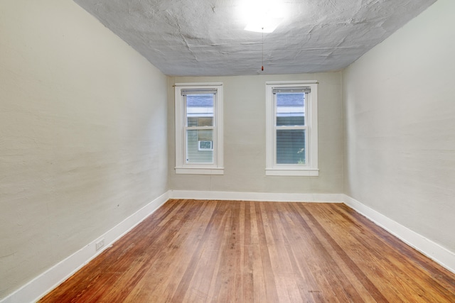 spare room featuring hardwood / wood-style flooring