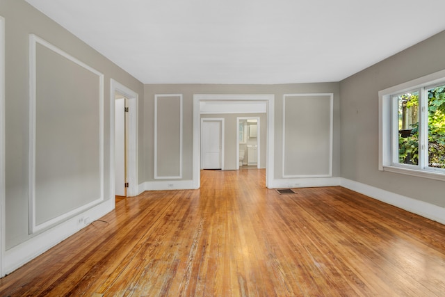 spare room featuring light wood-type flooring