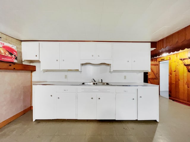 kitchen with white cabinetry and sink