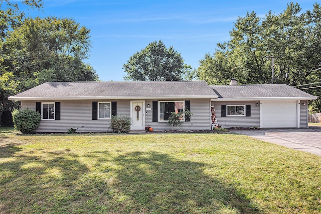 ranch-style home with a garage and a front lawn