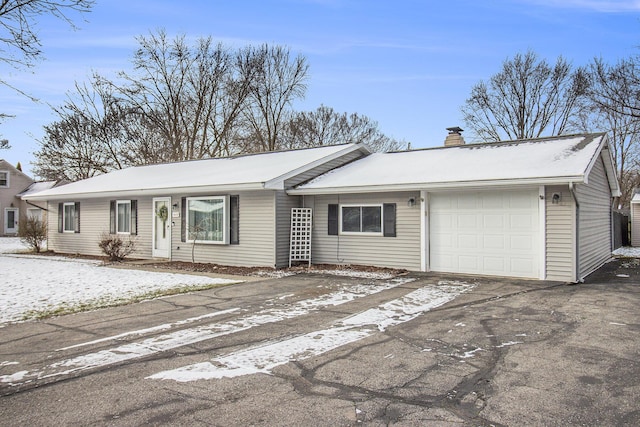 single story home featuring a garage