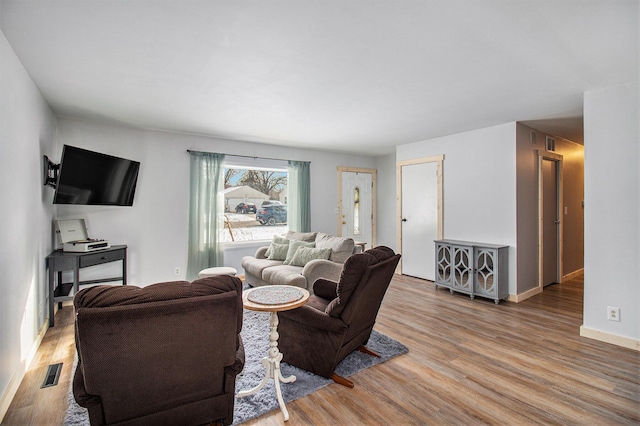 living room featuring light wood-type flooring