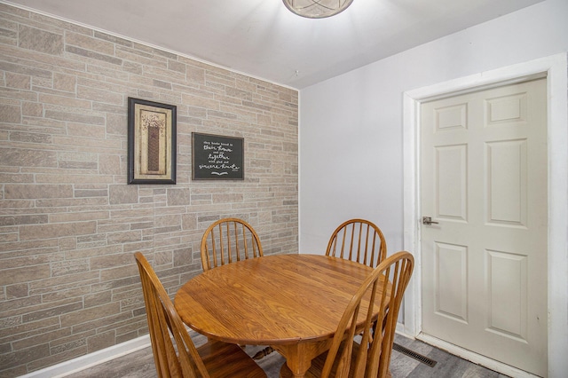 dining area featuring dark hardwood / wood-style flooring