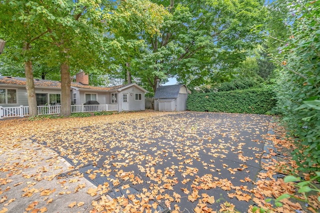 view of front of property with a shed