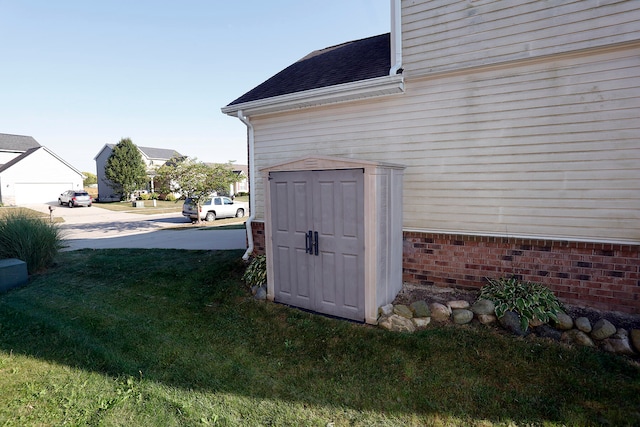 view of outbuilding featuring a yard