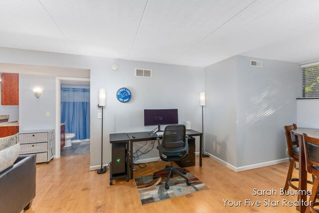 home office with light wood-type flooring