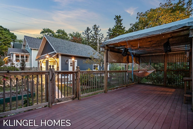 deck at dusk with an outdoor structure