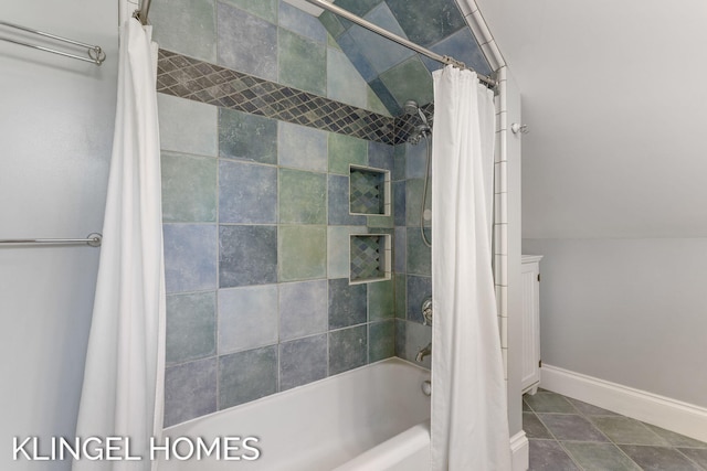 bathroom featuring shower / tub combo and tile patterned floors