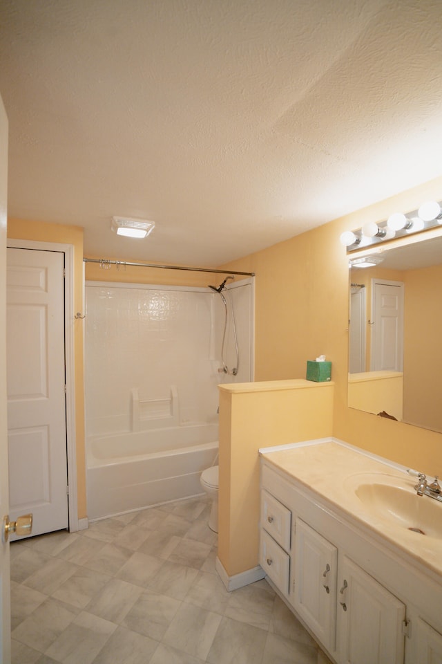 full bathroom featuring washtub / shower combination, a textured ceiling, vanity, and toilet