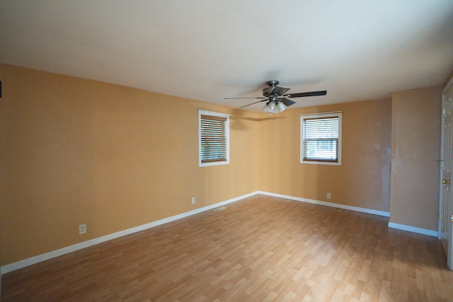 empty room featuring ceiling fan and wood-type flooring