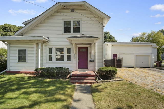 view of front of house with a garage and a front lawn