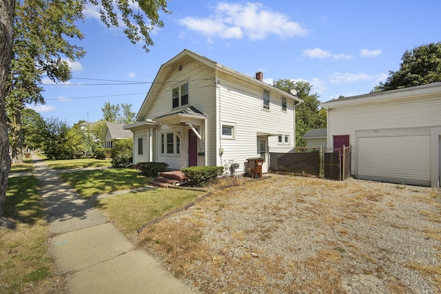 view of front property with a front lawn and a garage