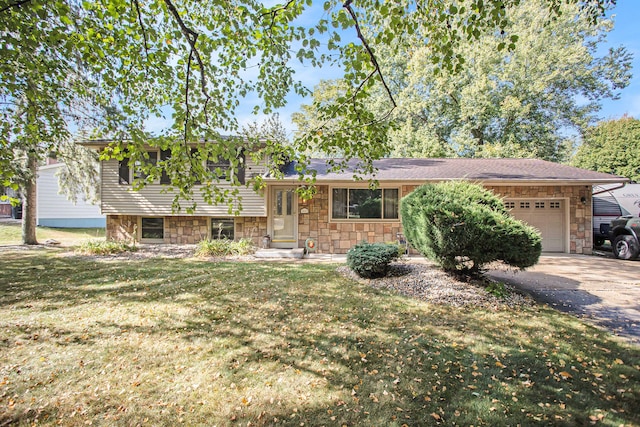 view of front of property with a front yard and a garage