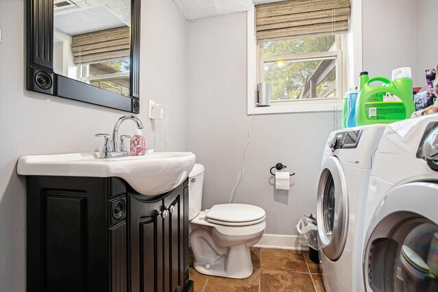 laundry area with washing machine and dryer