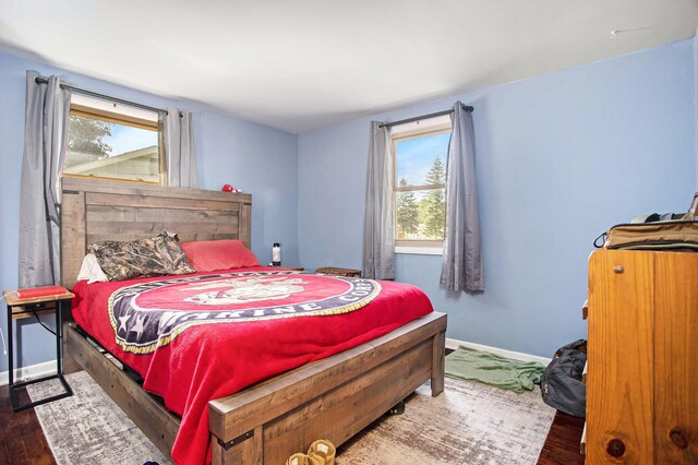 bedroom featuring dark wood-type flooring