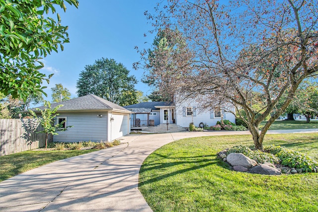 view of front of home featuring a front yard and a garage