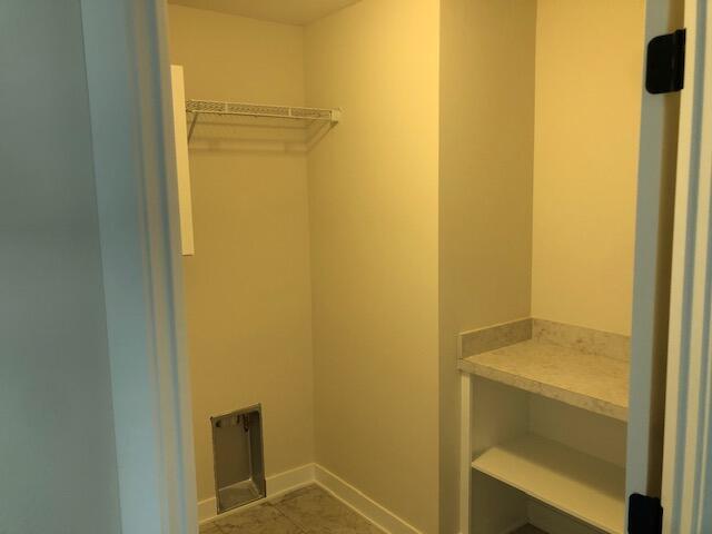 spacious closet featuring tile patterned floors