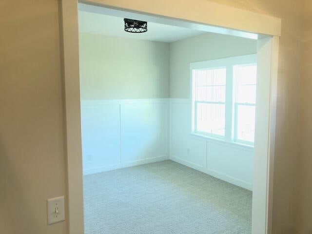 spare room with light colored carpet