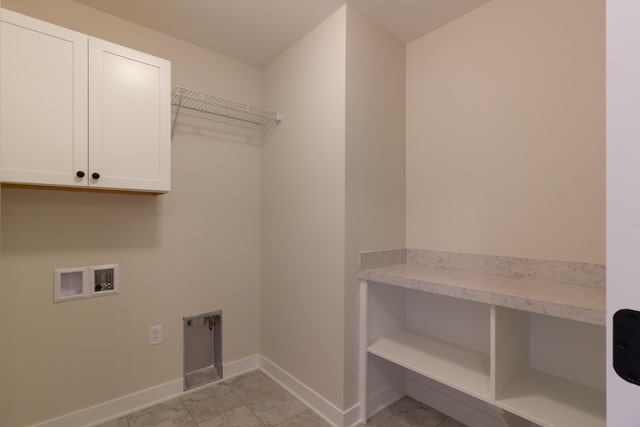 laundry area with washer hookup, cabinets, and electric dryer hookup